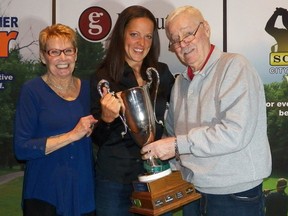 Luci Leblanc accepts the Preston Cup for the Slammer Tour's Slammer of the Year from Bill and Carole Ryan. (Submitted Image)
