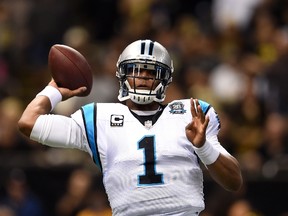 Cam Newton of the Carolina Panthers throws a pass against the New Orleans Saints during the first quarter at Mercedes-Benz Superdome on December 7, 2014 in New Orleans, Louisiana. (Stacy Revere/Getty Images/AFP)