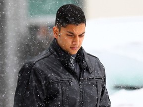 Former Peel police Const. Abel Gomes walks out of Brampton court after being found not guilty on Thursday, December 11, 2014. Gomes was accused of coercing a bipolar woman into having sex with him with a threat of returning her to a hospital psychiatric ward. (Dave Abel/Toronto Sun)