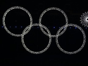 Four out of five Olympic rings are seen lit up during the opening ceremony of the 2014 Sochi Winter Olympics, in this February 7, 2014 file photo. REUTERS/David Gray/Files