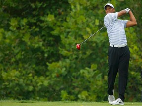 Tiger Woods of the U.S. hits his drive on the fourth hole during the second round of the 2014 PGA Championship at Valhalla Golf Club in Louisville, Kentucky, August 8, 2014. (REUTERS/Brian Snyder)