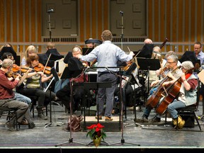 Members of Orchestra London rehearse at Centennial Hall. (Free Press file photo)