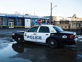 Police are on scene at 105 Avenue and 101 Street after a shooting took place shortly after midnight in Edmonton, Alta., on Thursday, Dec. 11, 2014. Codie McLachlan/Edmonton Sun