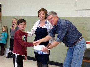 Submitted photo: Ten-year old Jack Murphy of Port Lambton donated $430 to Brander Park Splash-pad chairs Anne Hazzard and David Cram on Nov. 29 at a pancake fundraiser. Murphy raised the money at his birthday party last month, as he requested from his friends to bring donations to the splash-pad in lieu of gifts for him.