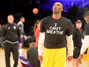 Los Angeles Lakers guard Kobe Bryant wears a t-shirt during warmups before a game against the Sacramento Kings to show support for the family of Eric Garner at Staples Center on Dec. 9, 2014. (Jayne Kamin-Oncea/USA TODAY Sports)