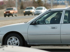 A man talks on his cellphone while driving at 101 ave and 50 st on April 3.
