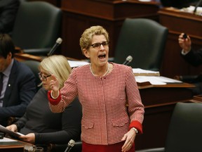 Ontario Premier Kathleen Wynne at the Ontario legislature's final day before Christmas break at Queen's Park in Toronto on Thursday, December 11, 2014. 
(Stan Behal/Toronto Sun)