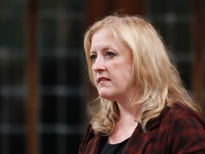 Canada's Transport Minister Lisa Raitt speaks during Question Period in the House of Commons on Parliament Hill in Ottawa, Oct. 7, 2014. (CHRIS WATTIE/Reuters)