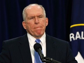 CIA director John Brennan pauses during a press conference at CIA headquarters in Langley, Va., Dec. 11, 2014. (LARRY DOWNING/Reuters)