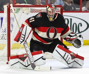 Ottawa Senators' netminder Craig Anderson prepares to make a save against the Los Angeles Kings' during NHL hockey action at the Canadian Tire Centre in Ottawa, Ontario on Thursday December 11, 2014. Errol McGihon/Ottawa Sun/QMI Agency