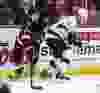 Ottawa Senators' Mark Stone moves the puck past Los Angeles Kings' Jake Muzzin during NHL hockey action at the Canadian Tire Centre in Ottawa, Ontario on Thursday December 11, 2014. Errol McGihon/Ottawa Sun/QMI Agency
