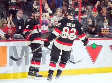 Dec 11, 2014; Ottawa, Ontario, CAN; Ottawa Senators right wing Bobby Ryan (6) celebrates his goal with defenseman Eric Gryba (62) in the second period against the Los Angeles Kings at the Canadian Tire Centre. Mandatory Credit: Marc DesRosiers-USA TODAY Sports