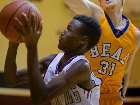 Beal?s James Jackson doesn?t give Banting?s Bruno Pande much of a view of the basket during their TVRA Central senior boys basketball game at Banting on Thursday. Beal won 50-39 in an early season preview of the likely conference championship matchup.  (MIKE HENSEN, The London Free Press)