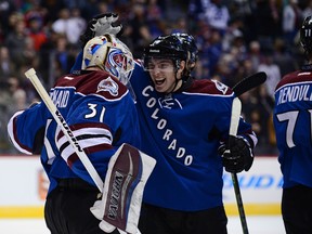 Colorado Avalanche goalie Calvin Pickard (31) and center Matt Duchene (9) celebrate the shootout win over the Winnipeg Jets at the Pepsi Center. The Avalanche defeated the Jets 4-3. in a shootout period. Mandatory Credit: Ron Chenoy-USA TODAY Sports