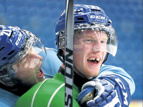 Sudbury Wolves forward Matt Schmalz, right, and teammate Pavel Jenys ham it up at practice last week. GINO DONATO/THE SUDBURY STAR