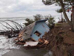 A home sits off of its foundation in Washaway Beach, Washington December 11, 2014 as a Pacific winter storm hits the western United States. The same storm lashed northern and central California on Thursday with heavy rain and high winds, knocking out electricity to tens of thousands of homes, disrupting commercial flights and prompting school closures in the San Francisco Bay area.  REUTERS/David Ryder