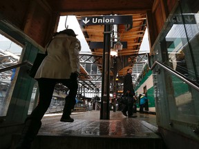 A passenger steps onto the train platform at Union Station in Toronto. )Jack Boland/Toronto Sun/QMI Agency files)