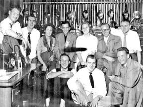 Members of The Free Press photography department smile for the camera in an image taken around 1948. In the back row are Ron Laidlaw, left, Mac McEwen, Jeanne Graham, Ken Dougan, Jane Fisher, Jack Burnett and Jack Schenk. In the front row are Ken Smith, left, Bill Smith and Bob Turnbull. (Free Press file photograph)