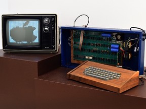 A press preview at Christie's on Dec. 5, 2014 displays The Ricketts Apple-1 Personal Computer, as part of the auction house' inaugural Exceptional Sale in New York. It sold at the Dec. 11 auction at Rockefeller Center for US$365,000. (AFP PHOTO /Timothy A. Clary)