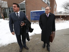 Councillor Giorgio Mammoliti, left, leaves court with his lawyer after pleading guilty to overspending in the 2010 election. (JACK BOLAND/Toronto Sun)