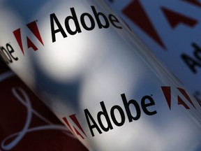 Adobe company logos are seen in this picture illustration taken in Vienna July 9, 2013. REUTERS/Leonhard Foeger