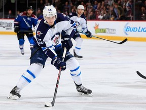 Mark Scheifele #55 of the Winnipeg Jets controls the puck just before he scores against the Colorado Avalanche to take a 3-1 lead in the third period on Thursday.
