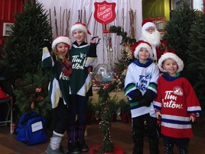 Spruce Grove Minor Hockey Players and Spruce Grove Ringette players came out to work the Salvation Army Christmas Kettle on Jersey Day in Canada at Freson Brothers. - Photo Submitted