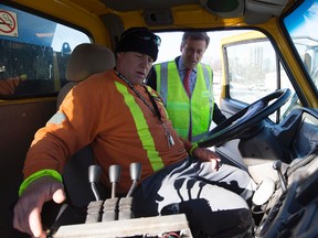 Mayor John Tory drops into a Toronto public works yard and speaks with Dave Kirby on Dec. 12, 2014  to say thank you for a quick response to the first snow storm of the year. (Dave Abel/Toronto Sun)