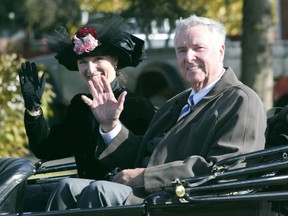 Maureen Rooney, an actor portraying Janet  Griesbach, and Edmonton Mayor Bill Smith wave upon arrival at the Village of Griesbach community statue unveiling ceremony on Saturday afternoon. The statue of Janet Griesbach, a military wife who was actively involved in community groups and support for other military wives through-out the First World War, was unveiled by Mayor Smith and Deputy Prime-Minister Anne McClellan in front of a large audience of a Edmontonians.