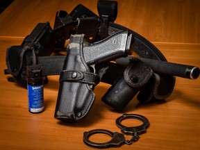 A standard issue tool belt for Ottawa Police (including gun, pepper spray, baton, handcuffs) is pictured in this April 24,2013 file photo.  (Errol McGihon/QMI Agency)