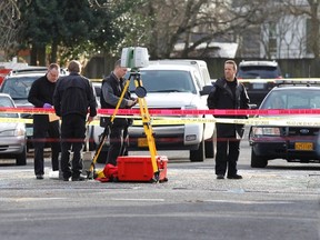 Police investigate outside the Rosemary Anderson High School in Portland, Oregon December 12, 2014. (REUTERS/Steve)