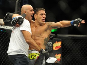 Rafael dos Anjos celebrates after defeating Benson Henderson in a lightweight bout Aug. 23, 2014 at BOK Center in Tulsa, Okla. (Mark D. Smith/USA TODAY Sports)