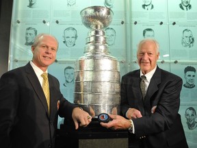 Hockey Hall of fame inductee Mark Howe (left) poses with dad Gordie Howe during a news conference in Toronto in this file photo from November 14, 2011. (REUTERS/Mike Cassese/Files)