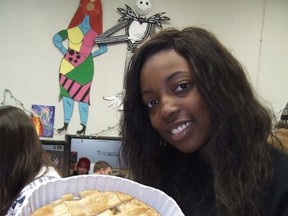 HAROLD CARMICHAEL/SUDBURY STAR
Josephine Suorineni holds up an apple pie, which was served Friday as part of a Christmas meal at the Sudbury Action Centre for Youth.