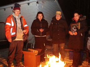 JOHN LAPPA/THE SUDBURY STAR
Family friend James Paquette, left, and family members Shelly Assinewai-Plume, Loretta Fox-Assinewai-Plume and Shannon Assinewai hold a ceremony for Russell Plume on Friday. Russell Plume was fatally injured inside his Mountain Street apartment nearly two weeks ago.