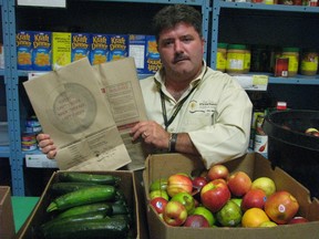 Myles Vanni, executive director of Sarnia's Inn of the Good Shepherd, is shown in this file photo at the agency's food bank. It recently received provincial funding to expand refrigeration space in its warehouse.