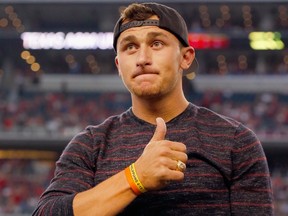 Johnny Manziel of the Cleveland Browns reacts after receiving his Aggie Ring during half time of the Southwest Classic at AT&T Stadium on September 27, 2014. (Tom Pennington/Getty Images/AFP)