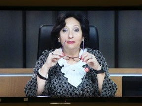 Justice France Charbonneau is seen on a television screen in Montreal, April 25, 2013.  REUTERS/Christinne Muschi