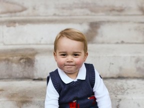 Britain's Prince George poses in a courtyard at Kensington Palace in London in this one out of three official Christmas photographs of him taken in late November and released on December 13, 2014.  REUTERS/TRH The Duke and Duchess of Cambridge/Handout via Reuters