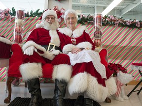 Roger and Patricia Moreau are shown here preparing for their event at Kanata's Superstore Saturday, Dec. 13, 2014. On Sunday, Dec. 14, 2014 the Michele Heights Community Centre hosts a kids' Christmas Party where kids will get to tell Santa and Mrs. Claus what they want while participating in activities. The Michele Heights are has been the scene of violent gunfire in recent weeks.
DANI-ELLE DUBE/Ottawa Sun/QMI AGENCY