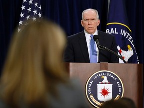 Director of the Central Intelligence Agency (CIA) John Brennan listens to a reporter's question during a rare news conference at CIA Headquarters in Virginia, December 11, 2014.  (REUTERS/Larry Downing)