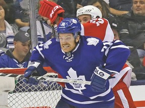 Maple Leafs’ David Clarkson battles with Red Wings’ Jonathan Ericsson during Saturday night’s game at the Air Canada Centre. (CRAIG ROBERTSON/Toronto Sun)