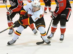 Belleville Bulls rookie forward Brandon Saigeon attempts to split the Ottawa 67's defence during OHL action Saturday night at Yardmen Arena. (Don Carr for The Intelligencer)