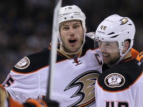 Anaheim Ducks centre Ryan Getzlaf (left) celebrates his second-period goal with defenceman Colby Robak during NHL action against the Winnipeg Jets at MTS Centre in Winnipeg, Man., on Sat., Dec. 13, 2014. Kevin King/Winnipeg Sun/QMI Agency