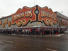 Hundreds in line ahead of Honest Ed's annual turkey giveaway Dec. 14, 2014. (Shawn Jeffords/Toronto Sun)