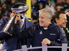 Seattle Seahawks head coach Pete Carroll holds the Vince Lombardi trophy to after the Seahawks defeated the Denver Broncos in the NFL Super Bowl XLVIII football game in East Rutherford, New Jersey, February 2, 2014.  (REUTERS)