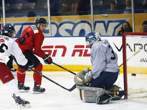 Nick Baptiste of Team Canada tries to score against the CIS all-stars in Toronto on Sunday, Dec. 14, 2014. (Michael Peake/Toronto Sun/QMI Agency)