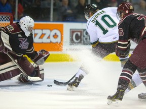 Knights forward Christian Dvorak slips a backhand through the legs of Peterborough Petes goalie Scott Smith during the first period of London?s 5-2 win at Budweiser Gardens on Sunday. (MIKE HENSEN, The London Free Press)