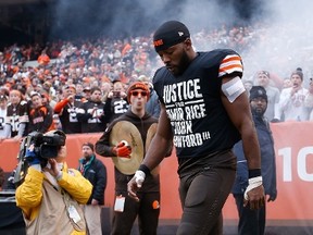 Andrew Hawkins #16 of the Cleveland Browns walks onto the field while wearing a protest shirt during introductions prior to the game against the Cincinnati Bengals at FirstEnergy Stadium on December 14, 2014 in Cleveland, Ohio.  (Joe Robbins/Getty Images/AFP)