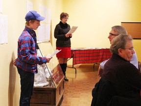 Volunteer Luke Hendriks (foreground) and Blyth 14/19 administrative assistant Karen Stewart (background) read a selection of excerpts from letters written by Harold and Billie.